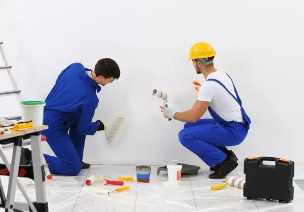 Professional painters working on a room transformation