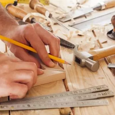 Skilled Carpenters at Work Crafting Wood into Artistry